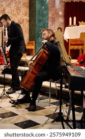 Two musicians play wind and string instruments inside a beautifully decorated church. The atmosphere is serene, with soft lighting and festive decorations enhancing the ambiance.