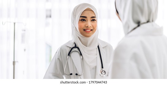 Two Muslim Asian Female Doctor Working And Talk In Hospital.healthcare And Medicine