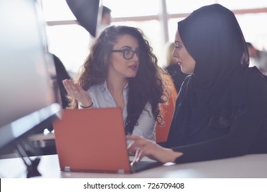 Two Muslim Business Woman Working On Their Laptop.