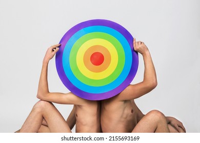 Two Naked Men Hold Rainbow Target And Hide Their Faces, Concept Of LGBTQ Pride, LGBTQ People, LGBTQ Rights Campaign, Same Sex Marriage