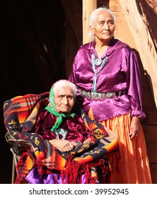 Two Navajo Wise Elderly Women Outdoors In Bright Sun