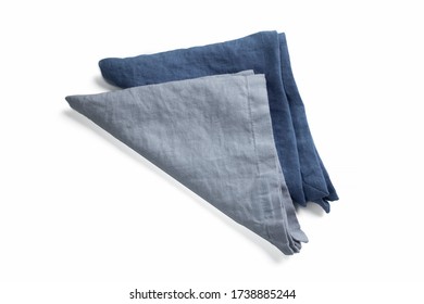 Two Navy Jeans Blue Linen Organic Raw Cotton Serving Napkin Or Kitchen Towelette Or Towel Triangle Form Folded. Rough Texturized Cloth Fabric Laying Isolated On White Background