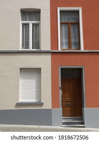 Two Neighbor Houses Next To Another With Different Colors Seem To Be One House  