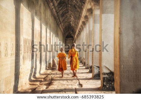 Two neophytes walking in an Angkor Wat, Siem Reap, Cambodia.