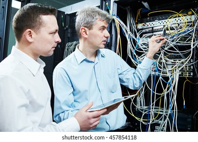 Two Network Support Engineers Administrating In Server Room