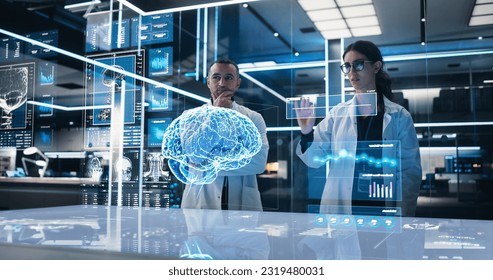 Two Neuroscientists Working With Computer-Powered VFX Hologram Of Human Brain And Nervous System In Futuristic Laboratory. Multiethnic Man And Woman Working On Solutions for Brain Tumor. - Powered by Shutterstock