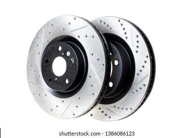 Two new brake discs with notches and perforations for better braking at high speeds. Photo on a white background. Auto shop - Shutterstock ID 1386086123
