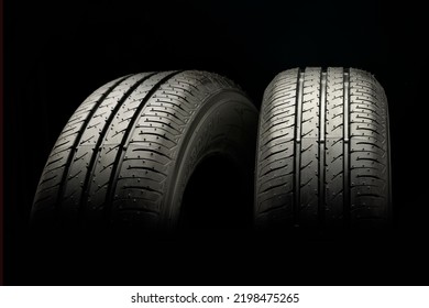 Two New Summer Wheels On A Black Tire Background