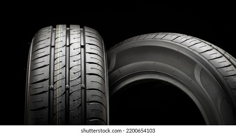 Two New Summer Wheels On A Black Tire Background Graphically