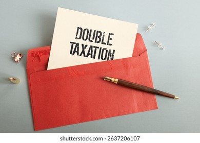 two notepads. open notepad with text DOUBLE TAXATION