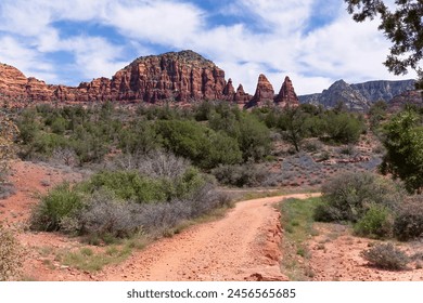 Two Nuns and Twin Buttes in Sedona Arizona, Red rocks, blue sky, and walking trails in the southwest, sedona arizona scenery with blue sky and mountains in background, showing desert flora - Powered by Shutterstock