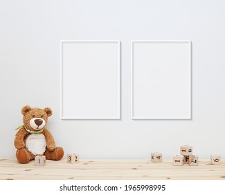 Two Nursery Frames Mockup, 2 Blank Frames Hanging On Wall In Baby Room, Soft Toy Bear And Wooden Blocks On Shelf.	
