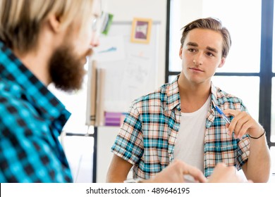 Two Office Workers At The Desk