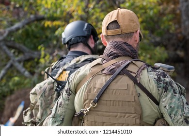 Two Officers From The Back Wearing Tactical Gear