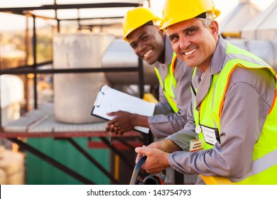 Two Oil And Chemical Industry Technicians In Plant