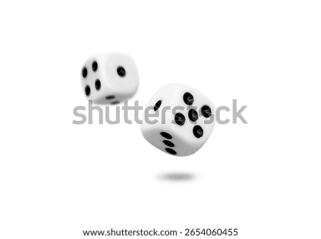Two old dice float from roll isolated on white background.