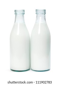 Two old fashioned milk bottles on white