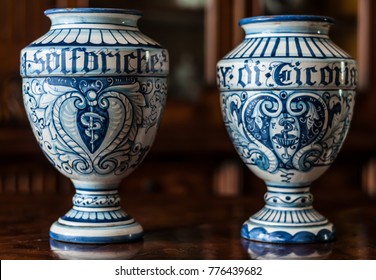 Two old italian ceramic pharmacy jars hand painted. The word 'sulfuriche' on the first one means sulfuric, the word 'cicoria' on the secon one means chicory.