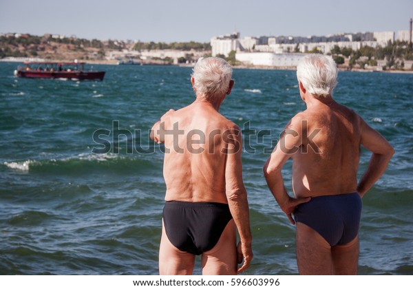 old man in swimming trunks