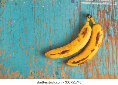 Two Old Ripe Bananas On Rustic Wooden Table, Top View