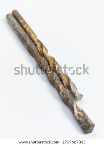 Two old rusty twist drill bits isolated on white background.