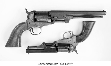 Two Old Western Six Shooter Cowboy Pistols In Black And White.