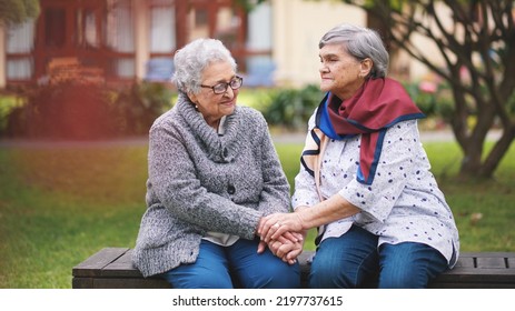 Two Old Women Sitting On Bench In Park Holding Hands Smiling Happy Life Long Friends Enjoying Retirement