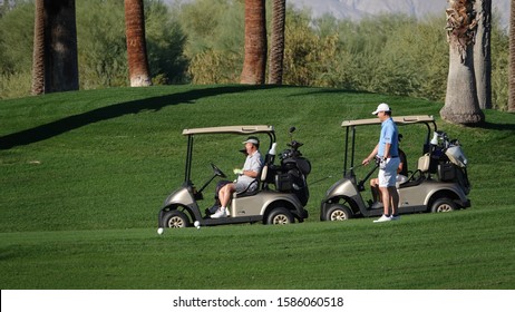 Two Older Men Play Golf At The JW Marriott Desert Springs Resort. Photo Taken In Palm Desert, CA / USA On November 14, 2019.