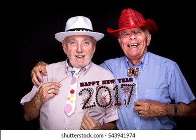 Two Older Old Gentlemen Guys Very Fancy Hat Wish You Happy New Year 2017 Isolated Funny On Black Background Having Fun Eve Party, Holding Cardboard Numbers