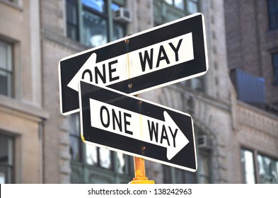 Two one-way signs on the street