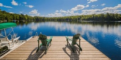 Two Ontario Chairs Sitting On A Wood Cottage Dock
