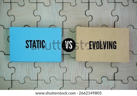 Two opposite words Static vs Evolving. Static means something is unchanged, fixed, or not moving. Evolving means something is gradually changing or developing over time.
