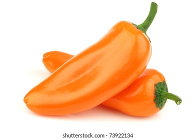 Two Orange Peppers(capsicum) On A White Background