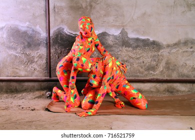 Two Orange Zentai Girls