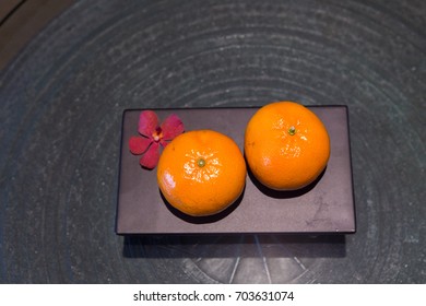 two oranges, two mandarines