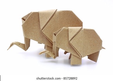 two origami elephants recycle paper