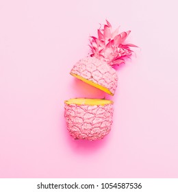 two painted in pink color halfs of the pineapple. fashion pink concept. minimalism and surrealism of food.  