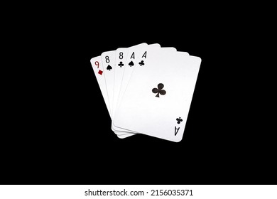 Two pair of eights and aces "Dead Man's Hand" poker hand isolated on black background