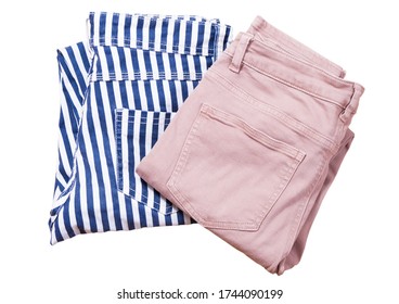 Two Pair Of Folded Casual Pants On A White Background Top View