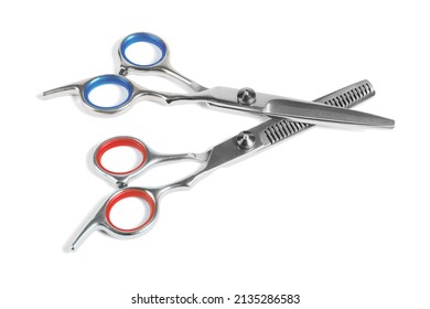 Two Pairs of Barber Scissors on White Background
