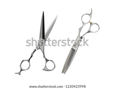 Two pairs of hairdressing scissors for hair cutting. isolated