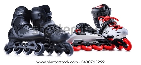 Two pairs of inline skates isolated on white background.