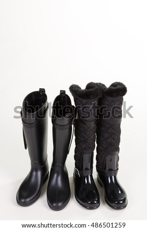 Similar – Image, Stock Photo Shiny rubber boots in the rain in front of a puddle-