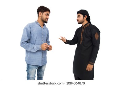 Two Pakistani Indian Muslim Brothers Angry Friends Fighting Or Roommates Arguing And Threatening In The Studio, Fighting To Each Other. Isolated On White Background. 