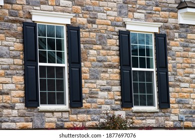 Two Pane Vinyl Window With Shutters On A Vinyl Siding House Siding