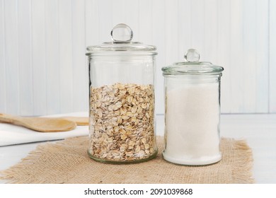 Two pantry jars with oats and white sugar, glass jars mockup for food sticker or label presentation.	