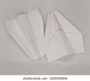 Two Paper Planes On A White Background