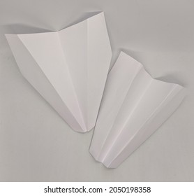 Two Paper Planes On A White Background