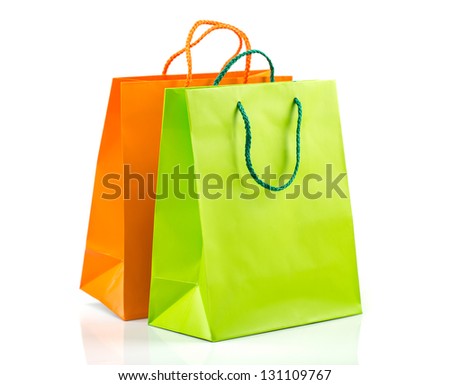 Two paper Shopping bags with reflection on white
