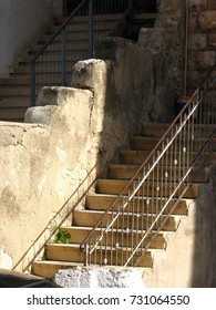 Two parallel adjacent cement staircases 